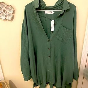 Good Company One Size button over green shirt
